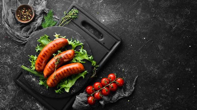 Grilled sausages on plate