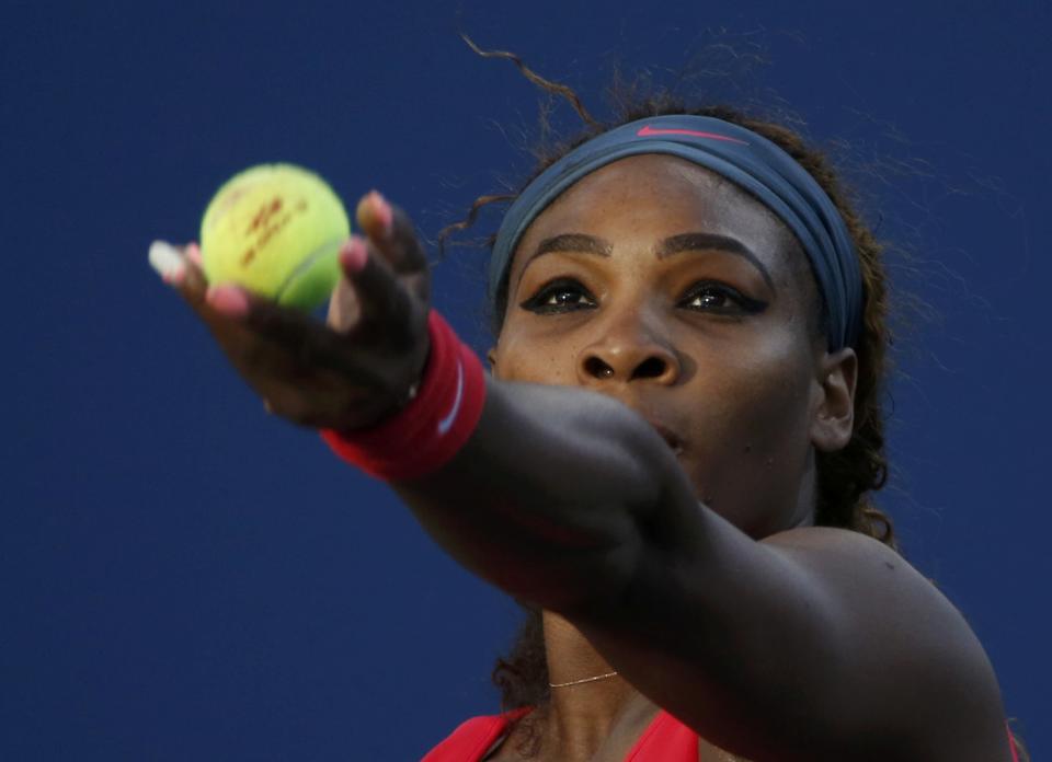 Serena Williams of the U.S. serves to Azarenka of Belarus during their women's singles final match at the U.S. Open tennis championships in New York