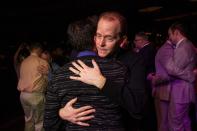 SEATTLE, WA - DECEMBER 9: Steve Rubio shares an emotional first dance with his husband Sonny Feldman during "A Wedding Reception for All," which was attended by hundreds and held at the Paramount Theatre on December 9, 2012 in Seattle, Washington. Today is the first day that same-sex couples can legally wed in Washington state. (Photo by David Ryder/Getty Images)