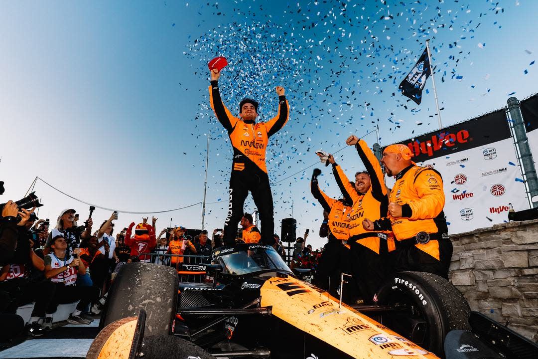 Pato O'Ward and his team celebrate their victory Saturday in the first of two NTT IndyCar Series Hy-Vee Milwaukee Mile 250 races at the Milwaukee Mile.