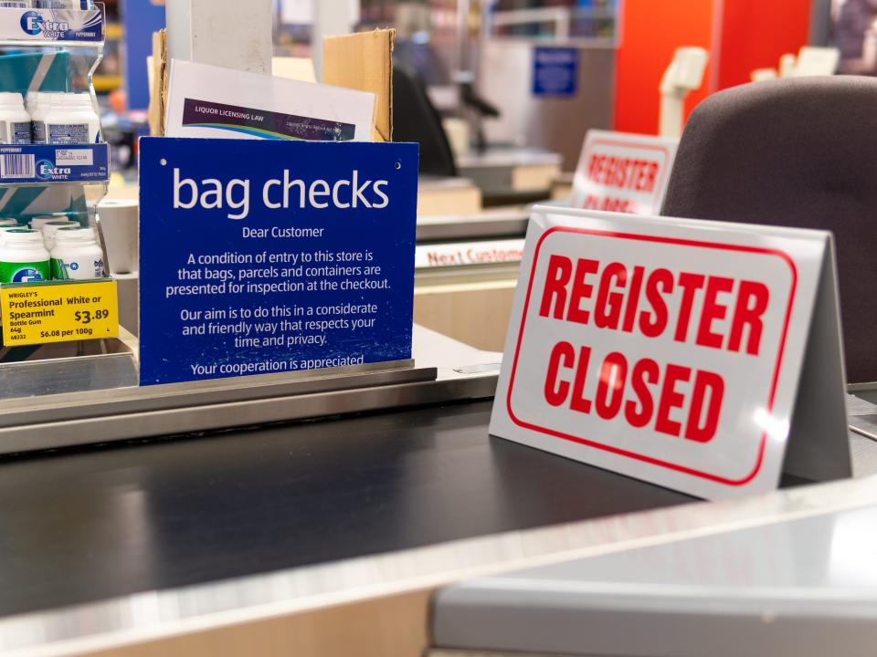 A "register closed" sign sits on an Aldi checkout line.