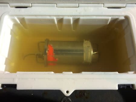 The data recorder from the sunken wreckage of the freighter El Faro rests in fresh water on the USNS Apache after being recovered in the Atlantic Ocean in a handout picture released by the National Transportation Safety Board (NTSB) August 8, 2016. NTSB/Handout via Reuters