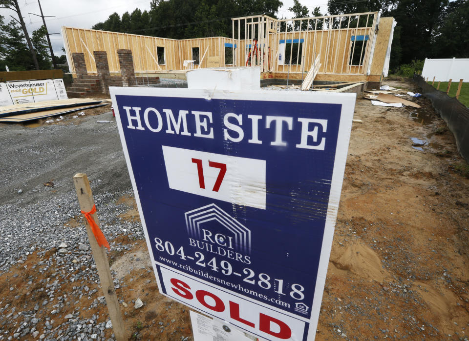 In this June 13, 2019, photo a new home is under construction in Mechanicsville, Va. On Tuesday, June 25, The Commerce Department reports on sales of new homes in May. (AP Photo/Steve Helber)