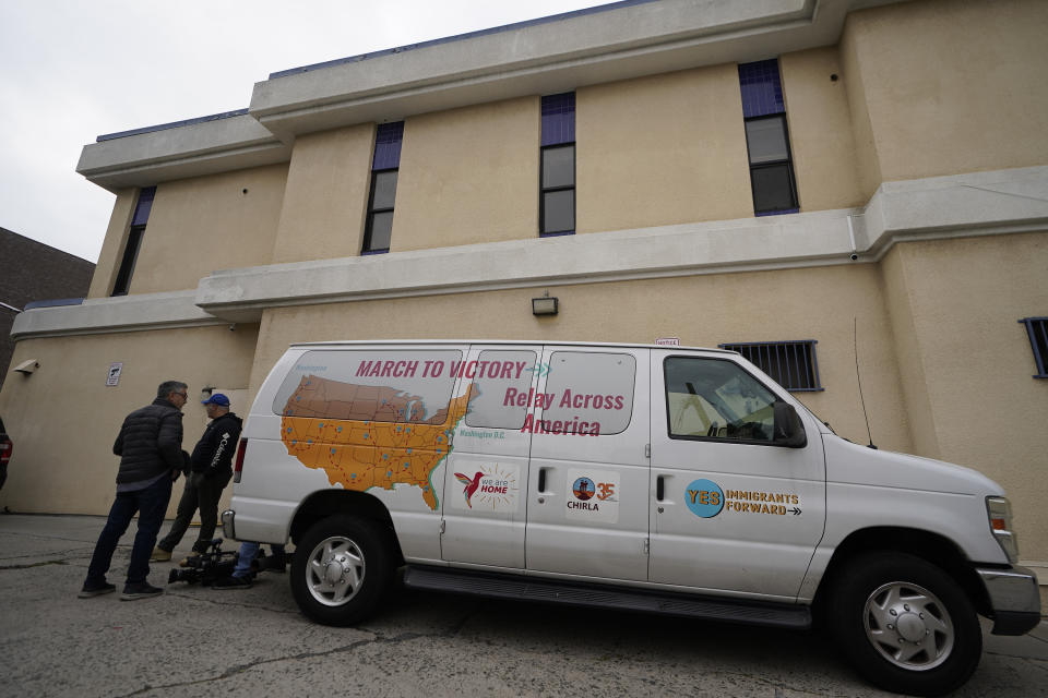 A van is parked outside St. Anthony's Croatian Catholic Church in Los Angeles on Wednesday, June 14, 2023. Forty-two migrants, including some children, were dropped off at Union Station around 4 p.m. Wednesday and were being cared for at the church. Texas Gov. Greg Abbott said the migrants were sent to Los Angeles because California had declared itself a "sanctuary" for immigrants. (AP Photo/Damian Dovarganes)