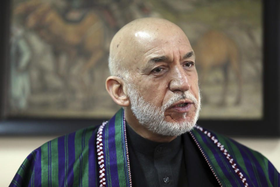 Former Afghan President Hamid Karzai speaks during an interview with the Associated Press in Kabul, Afghanistan, Thursday, March 11, 2021. Afghans are eager for peace and a recently floated U.S. draft for a deal between Taliban insurgents and the Afghan government is the best chance to accelerate stalled peace talks, ex-president Hamid Karzai said in an interview Thursday. (AP Photo/Rahmat Gul)