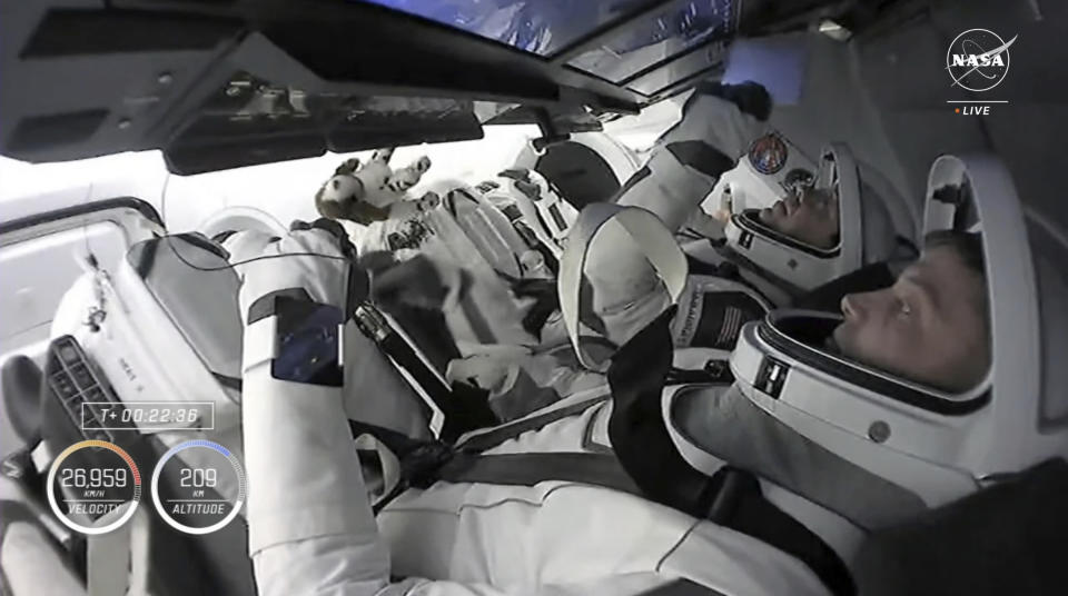 In this image taken from NASA video, commander Matthew Dominick, bottom right, and pilot Michael Barratt launch toward the International Space Station in a SpaceX capsule on Sunday, March 3, 2024, from Kennedy Space Center in Cape Canaveral, Fla. The crew of four will oversee the arrival of two new rocketships during their half-year stint. (NASA via AP)