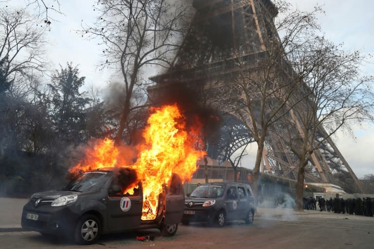 A Sentinelle security operation car was burned near the Eiffel Tower on the sidelines of a yellow-vest protest on February 9