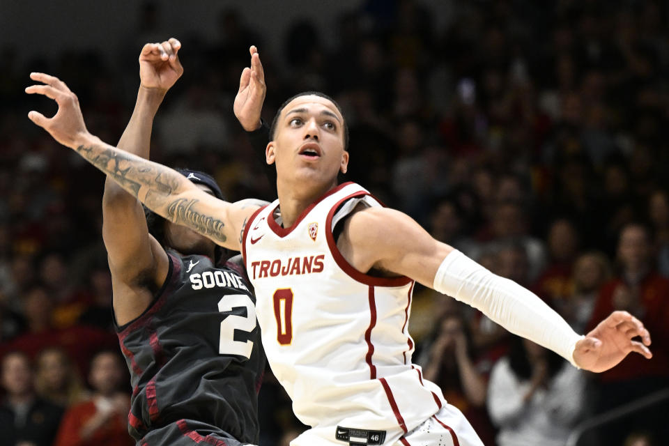 Southern California guard Kobe Johnson (0) watches the final shot by Oklahoma guard Javian McCollum (2) go in during the second half on an NCAA college basketball game Friday, Nov. 24, 2023, in San Diego. (AP Photo/Denis Poroy)