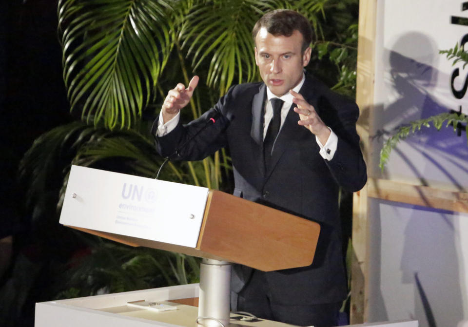 France's President Emmanuel Macron addresses delegates at the United Nations Environment Assembly in Nairobi, Kenya Thursday, March 14, 2019. Macron said at the conference Thursday that energy resources like coal that fueled industrialization in the developed world are no longer viable because they create pollution. (AP Photo/Khalil Senosi)