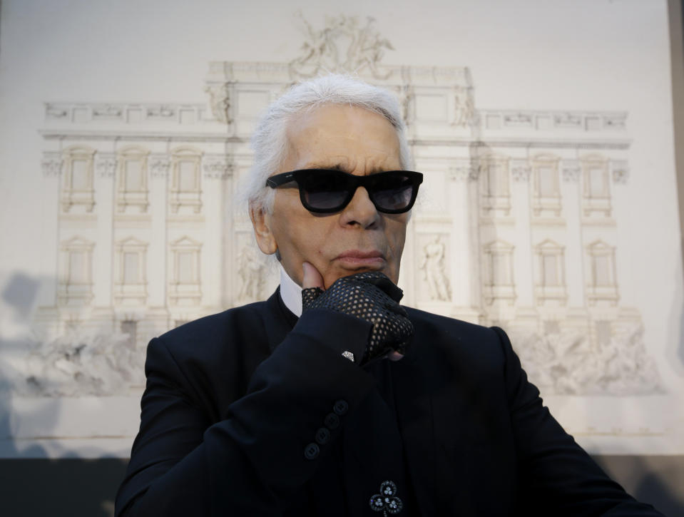 Designer Karl Lagerfeld poses for photographers prior to the start of a press conference, in Rome, Monday, Jan. 28, 2013. The Fendi fashion house is financing an euro 2.12 million ($2.8 million) restoration of Trevi Fountain in Rome, famed as a setting for the film "La Dolce Vita'' and the place where dreamers leave their coins. The 20-month project on one of the city's most iconic fountains was being unveiled at a city hall press conference Monday. (AP Photo/Gregorio Borgia)