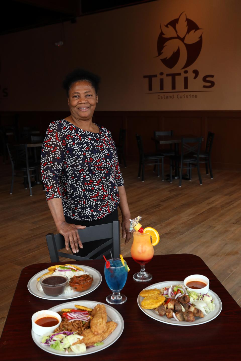 Owner and chef Rosemarie "TiTi" Durandisse of TiTi's Island Cuisine, a Haitian restaurant in Nyack, with some of her popular dishes March 24, 2022.