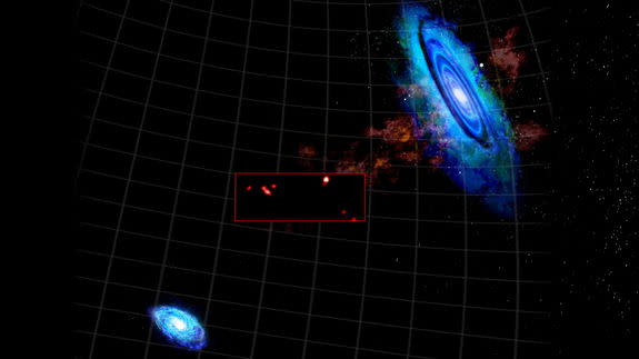 This combined graphic shows a high-resolution image (inset) from the Green Bank Telescope of recently discovered hydrogen clouds between the Andromeda Galaxy M31 (upper right) and Triangulum Galaxy M33 (bottom left). Image released May 8, 2013.