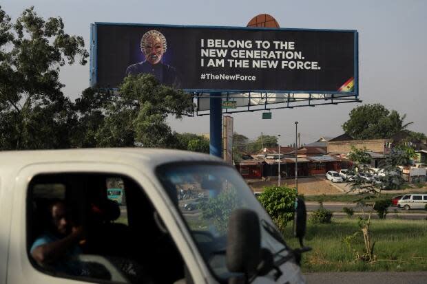 A general view of a billboard featuring a masked faced, suspected to be a new political opponent is seen on the streets of Accra, Ghana, on Dec. 13, 2023, ahead of the presidential elections scheduled for late 2024.  
