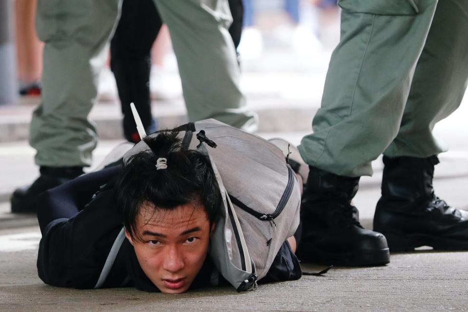 Hong Kong protester arrested on ground.JPG