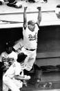 Los Angeles Dodgers manager Tom Lasorda leaps from the dugout as the Dodgers beat the New York Yankees, 8-7, to tie the World Series at two games apiece, Saturday, Oct. 24, 1981 in Los Angeles. (AP Photo)