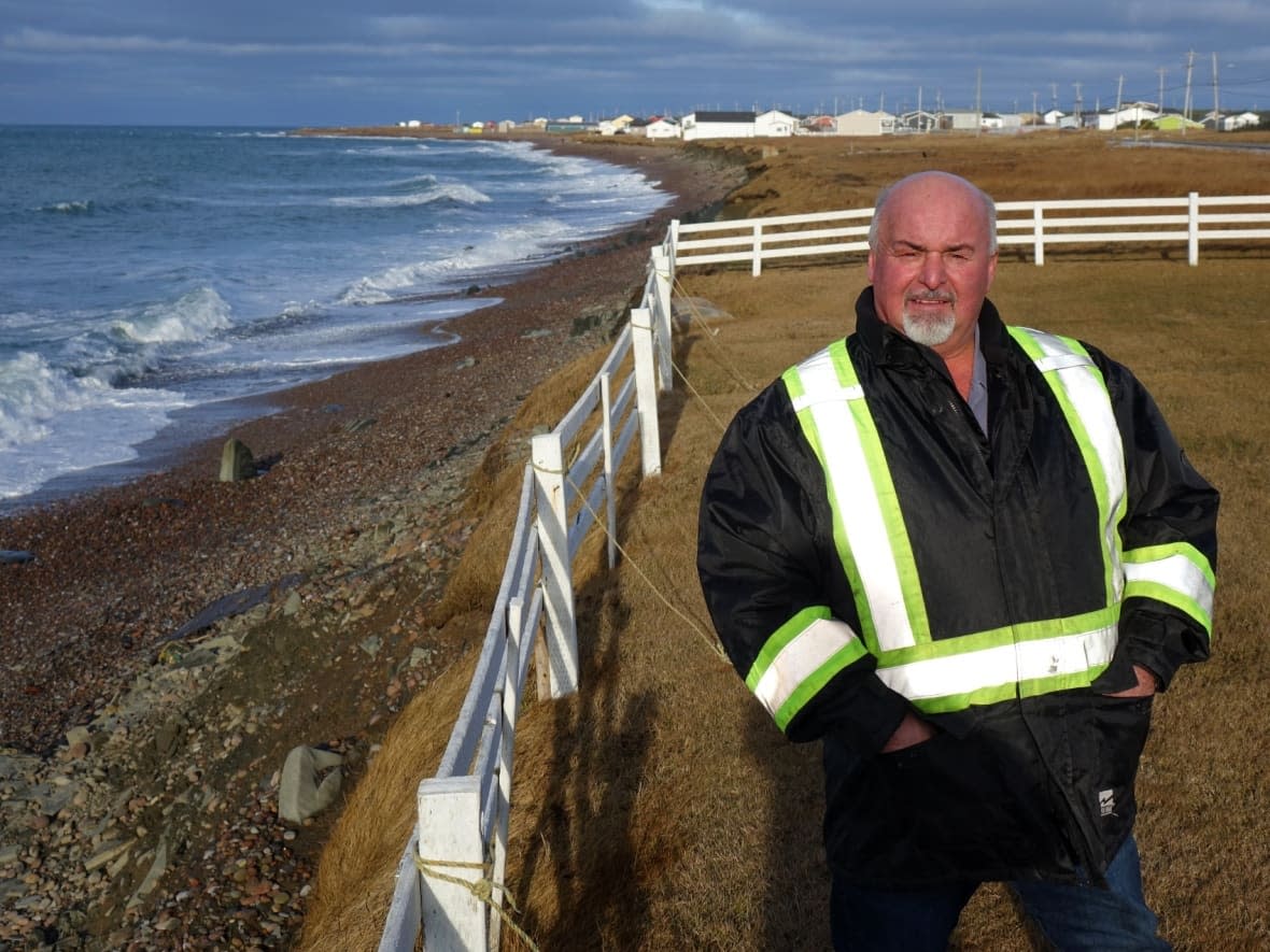 Mainland, N.L., resident Gordon Oliver says his property used to stretch about 10 metres deeper. Much of it has washed into the sea due to coastal erosion. (Patrick Butler/Radio-Canada - image credit)