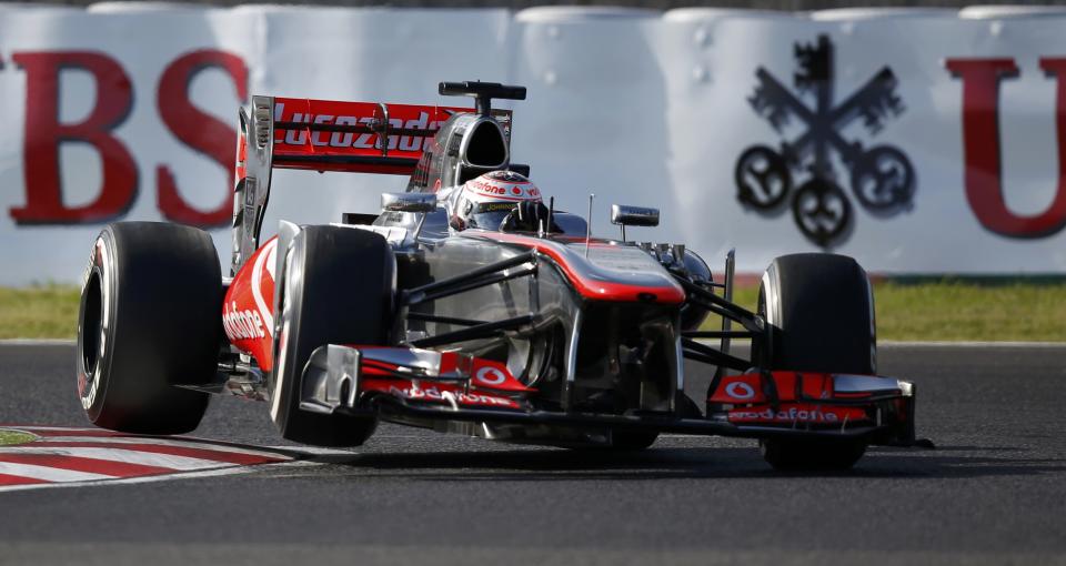 McLaren Formula One driver Jenson Button of Britain drives during the qualifying session of the Japanese F1 Grand Prix at the Suzuka circuit October 12, 2013. REUTERS/Toru Hanai (JAPAN - Tags: SPORT MOTORSPORT F1)