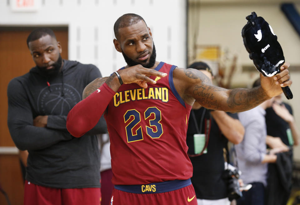 LeBron James looks himself in the mirror. (AP)