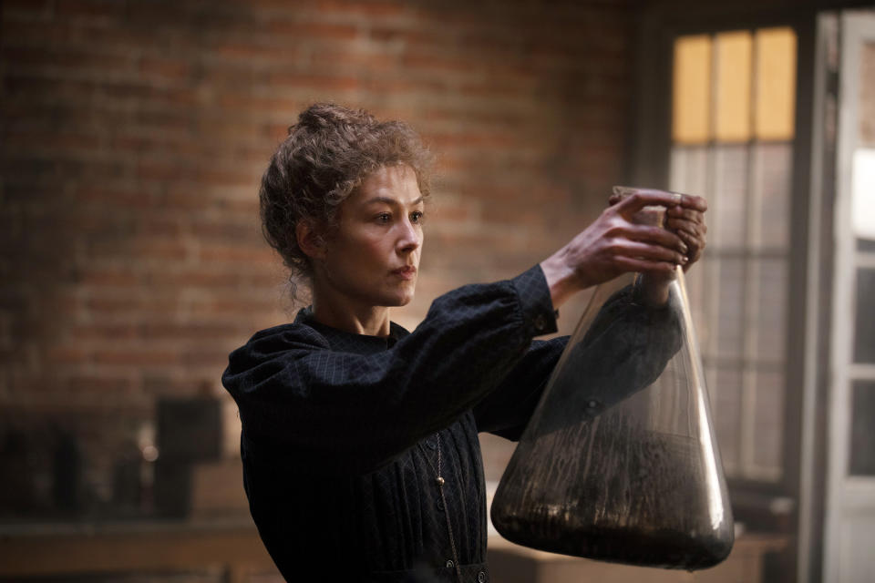 This image released by Amazon shows Rosamund Pike as Marie Curie in a scene from "Radioactive." (Amazon via AP)