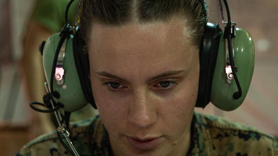 U.S. Marine Corps Sgt. Alyssa McKee, an air traffic control communications technician, conducts a radio check as part of a combat readiness evaluation during Balikatan at the Subic Bay International Airport in the Philippines on April 10, 2023. (Cpl. Kyle Chan/U.S. Marine Corps)