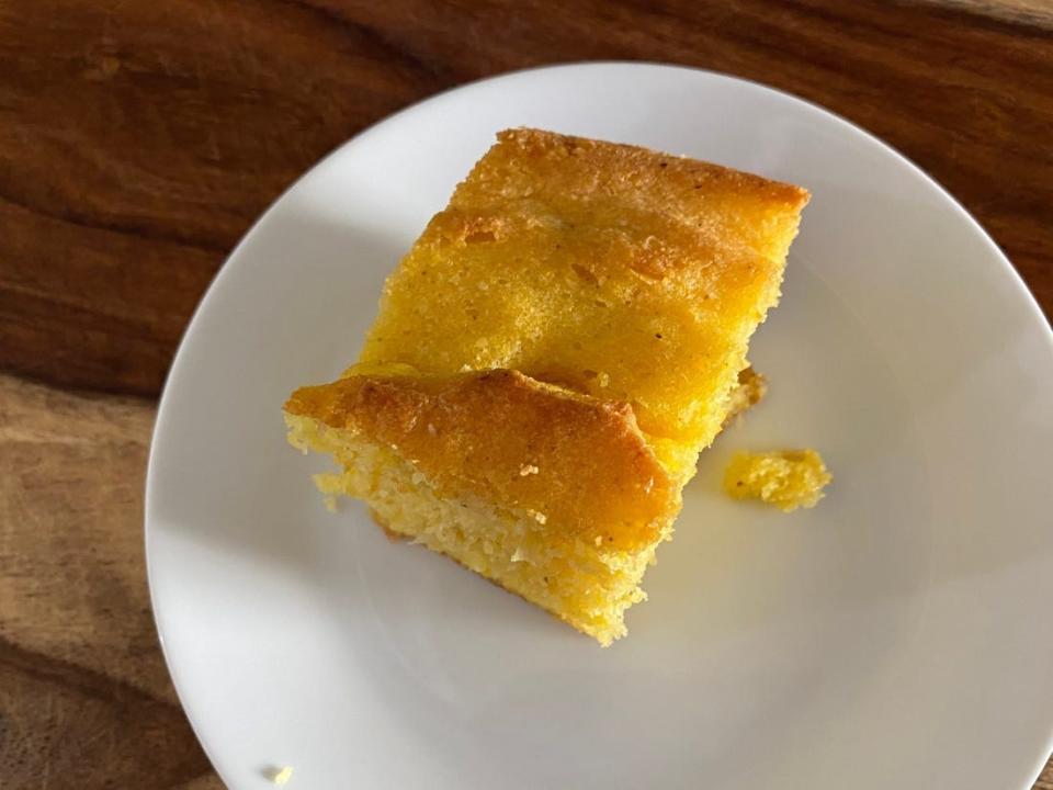 A slice of cornbread on a plate.