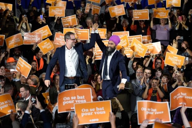 NDP Leader Jagmeet Singh and candidate Alexandre Boulerice campaign together during the 2019 federal election. Boulerice was the only NDP MP to survive that race, and the last of the NDP's Orange Wave MPs to hold his riding. (Nathan Denette / Canadian Press - image credit)