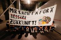 Climate change activists take part in a demonstration called "Rise up for change" in Bern