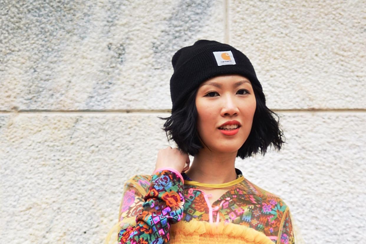 Everyone On Instagram Is Obsessed With This Stylish Beanie — and It Doubles As a Running Hat , MILAN, ITALY - SEPTEMBER 28: A guest poses wearing a Molly Goddard dress and a Carhart beanie before the Arthur Arbesser show during the Milan Fashion Week Spring/Summer 16 on September 28, 2015 in Milan, Italy. (Photo by Vanni Bassetti/Getty Images)