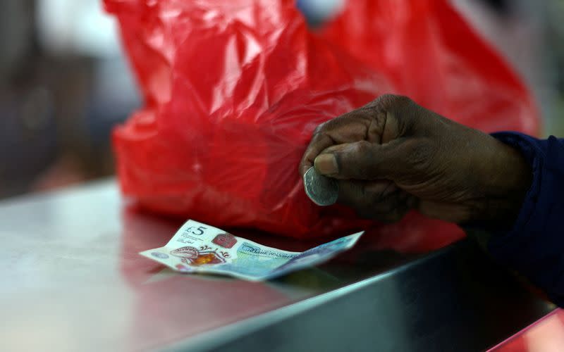 FILE PHOTO: People shop for groceries in south east London