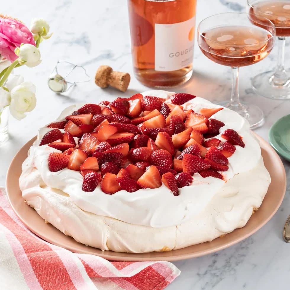 strawberry pavlova with bottle of wine