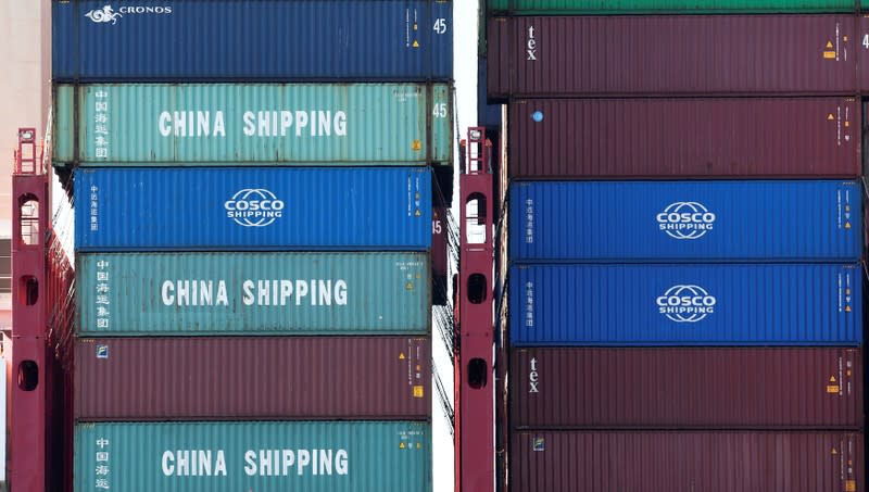 Containers of China Shipping and Cosco are loaded at a loading terminal in the port of Hamburg