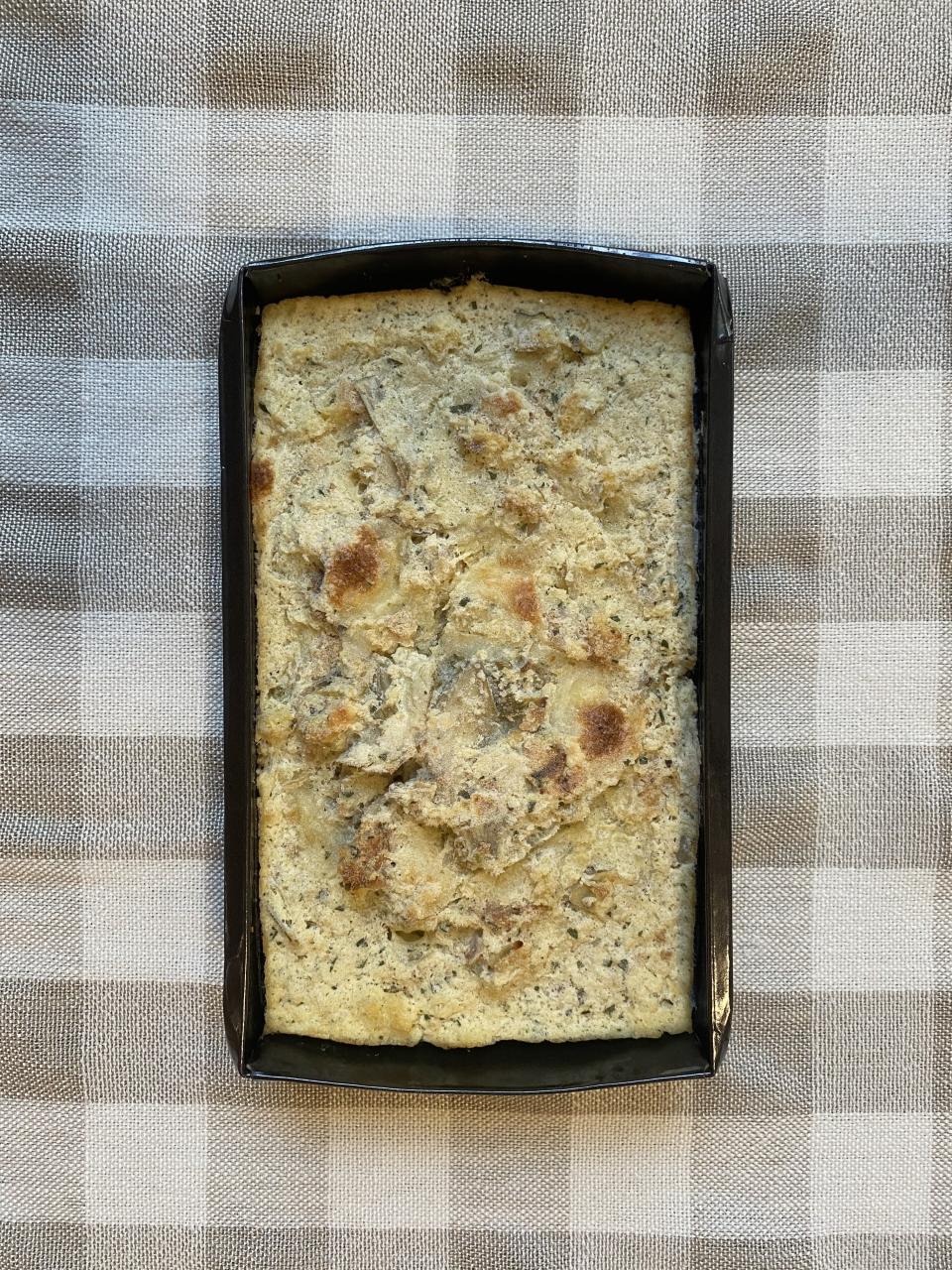 An open package of frozen Artichoke Bread Pudding