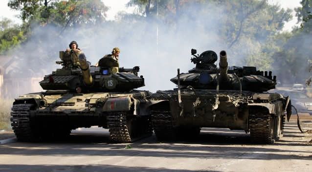 A Pro-Russian rebels tank is driven at speed in the town of Luhansk, eastern Ukraine, Sunday, Sept. 14, 2014. Photo: Getty