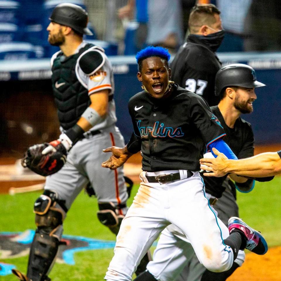 Miami Marlins infielder Jazz Chisholm Jr.†(2) reacts after scoring off a Jorge Alfaro (38) double in the tenth inning of an MLB game against the San Francisco Giants at loanDepot park in the Little Havana neighborhood of Miami, Florida, on Saturday, April 17, 2021.