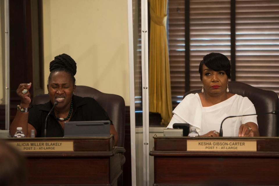 At-Large Alderwomen Alicia Miller Blakely and Kesha Gibson Carter look on as Savannah City Council discusses the details of the city's Memorandum of Understanding with the U.S. Attorney's Office at Thursday's City Council meeting. Both Blakely and Carter voted against the measure.