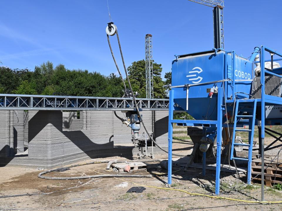 A 3D printer as it prints the walls of a tiny home.