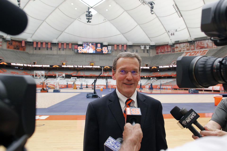 FILE - Syracuse University athletic director John Wildhack talks to the media during a visit to the Carrier Dome in Syracuse, N.Y., in this Tuesday, July 12, 2016, file photo. In the dead of winter Syracuse athletic director John Wildhack was brainstorming about the future and how to make some sort of social impact through sports. Wildhack floated the idea of an alliance with the MEAC, a group of historically black colleges and universities in the southeastern and mid-Atlantic regions of the country, that would include athletic competition, seminars on athletic compliance and fundraising, visiting professorships, and an internship exchange. (AP Photo/Nick Lisi, File)