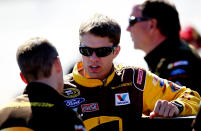 TALLADEGA, AL - OCTOBER 22: David Ragan, driver of the #6 UPS My Choice Ford, speaks with crew members during qualifying for the NASCAR Sprint Cup Series Good Sam Club 500 at Talladega Superspeedway on October 22, 2011 in Talladega, Alabama. (Photo by Jeff Zelevansky/Getty Images for NASCAR)