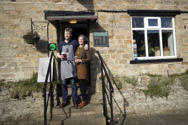 Embargoed to 0001 Friday March 3 Landlord Stuart Miller and his wife Melissa at the George and Dragon pub in Hudswell, North Yorkshire, which has been crowned the CAMRA Pub of the Year.