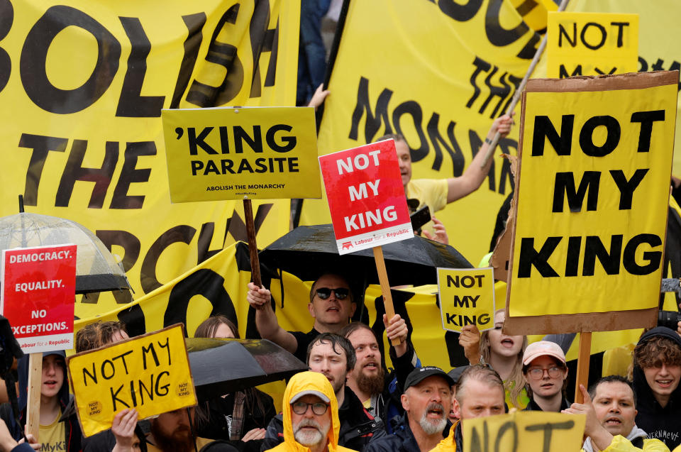 Hundreds of protesters held placards as people gathered for the coronation on Saturday despite rainy weather. (Photo by Piroschka van de Wouw - WPA Pool/Getty Images)