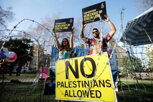 Rights group Amnesty International stages a demonstration outside the UK headquarters of US travel company TripAdvisor in London on January 30, 2019