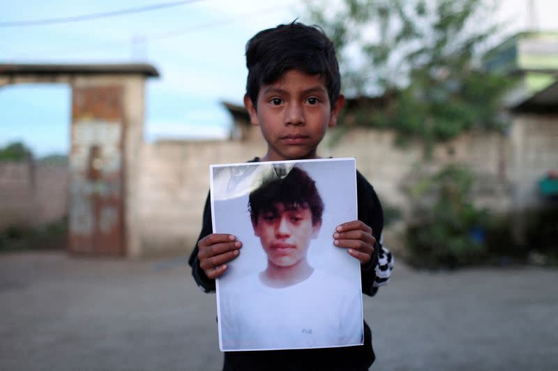 FILE PHOTO: Family and friends gather to mourn the dead of their loved ones who died in the U.S., in Nahuala