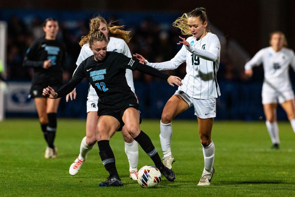 Brigham Young University midfielder Jamie Shepherd (12) and Michigan State midfielder Emerson Sargeant (19) play during the Sweet 16 round of the NCAA College Women’s Soccer Tournament at South Field in Provo on Saturday, Nov. 18, 2023. | Megan Nielsen, Deseret News