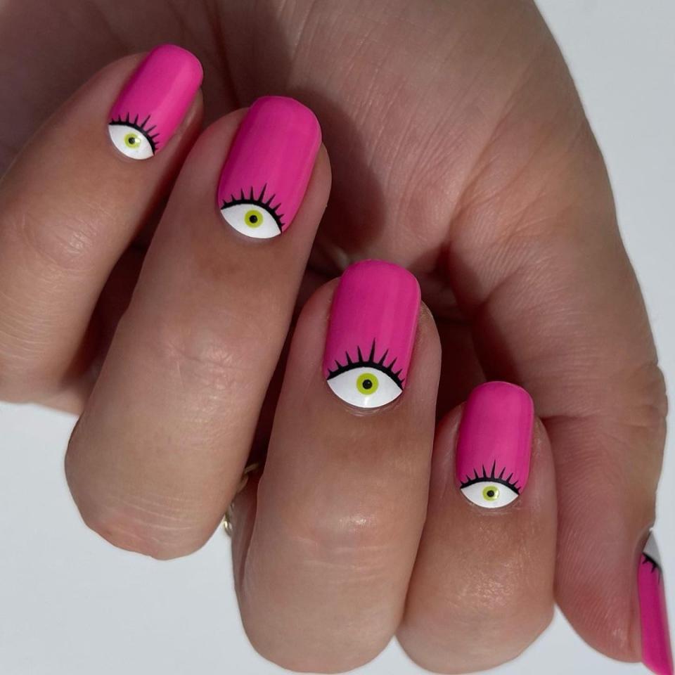Whether you're dressing as Weird Barbie or want to give your favorite shade of pink some freaky flair, you can't go wrong with these eye-design nails. But the best part? You can easily DIY with <a href="https://www.nailsofla.com/shop/p/pjlagt1j5qj0bhzindi5xxeis0arwz" rel="nofollow noopener" target="_blank" data-ylk="slk:Nails of LA's Big Energy Nail Wraps;elm:context_link;itc:0;sec:content-canvas" class="link ">Nails of LA's Big Energy Nail Wraps</a>.