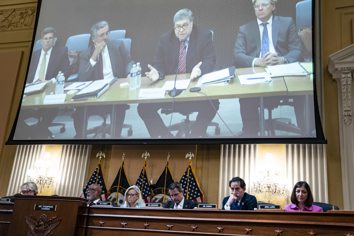 Attorney General William Barr appears on a screen as the House select committee investigating the Jan. 6, 2021, attack on the Capitol listens.