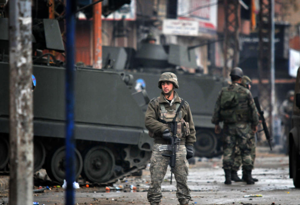 Lebanese army soldiers patrol a street in the northern Lebanese city of Tripoli on December 4, 2013 as the army deployed following clashes between supporters and opponents of Syria's regime. (IBRAHIM CHALHOUB/AFP/Getty Images)