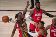 Oklahoma City Thunder's Dennis Schroder (17) is forced to pass the ball as Houston Rockets' Russell Westbrook, bottom center, Jeff Green (32) and P.J. Tucker (17) defend during the second half of an NBA first-round playoff basketball game, Monday, Aug. 31, 2020, in Lake Buena Vista, Fla. (AP Photo/Mark J. Terrill)