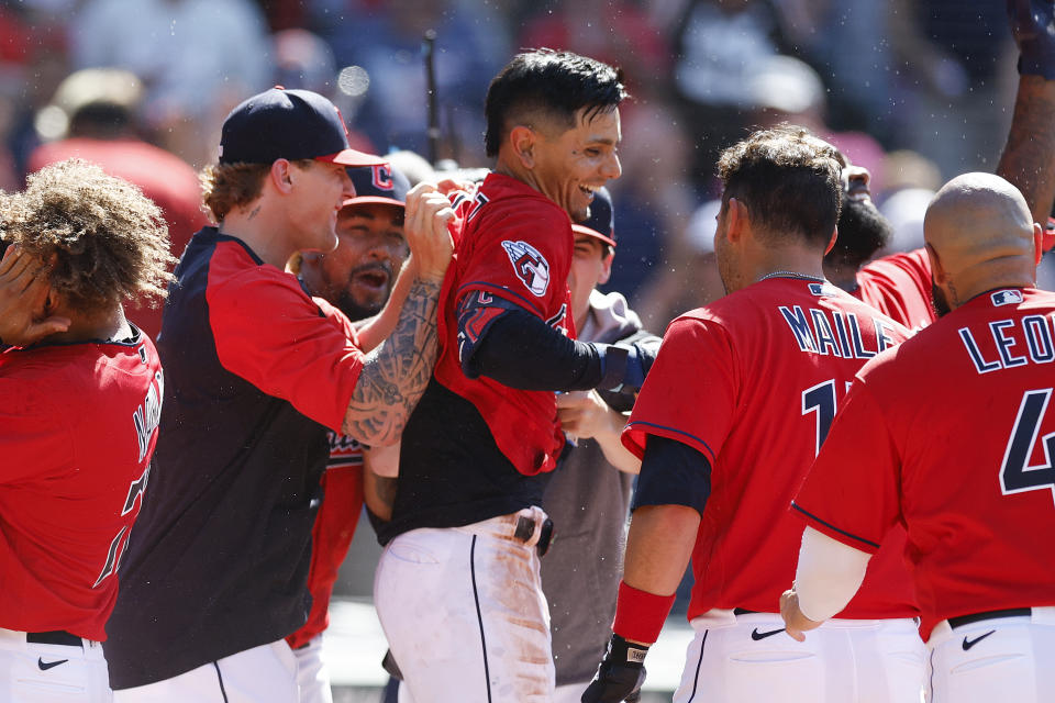 Cleveland Guardians' Andres Gimenez celebrates with teammates after hitting a game-winning, two-run home run against the Minnesota Twins during the ninth inning of a baseball game Thursday, June 30, 2022, in Cleveland. (AP Photo/Ron Schwane)