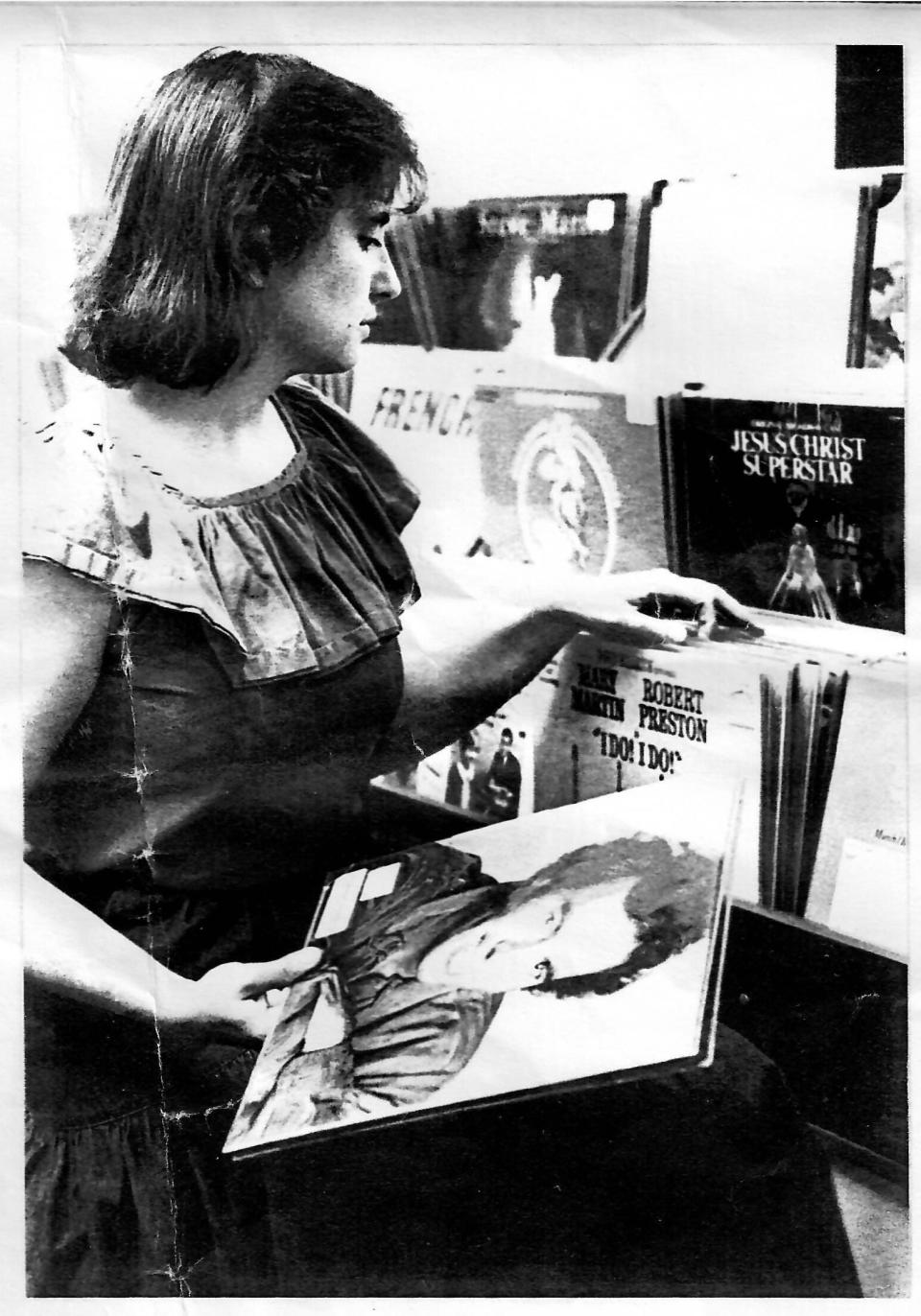 This photo of Sherie Brown appeared in the Sept. 28, 1984, edition of The Independent. The photo was showing off the new browsing bins constructed for the library's 3,000-album collection.