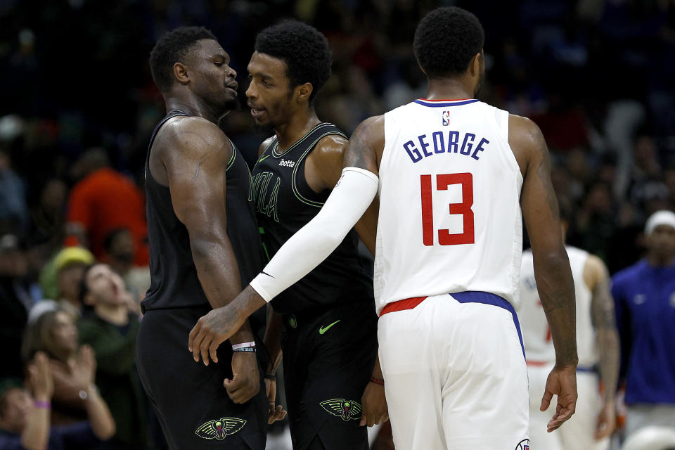 NEW ORLEANS, LOUISIANA - MARCH 15: Herbert Jones #5 of the New Orleans Pelicans and Zion Williamson #1 of the New Orleans Pelicans react after scoring against the LA Clippers during the fourth quarter of an NBA game at Smoothie King Center on 15 March 2024 in New Orleans, Louisiana.  NOTE TO USER: User expressly acknowledges and agrees that by downloading and/or using this photo, user agrees to the terms and conditions of the Getty Images License Agreement.  (Photo by Sean Gardner/Getty Images)